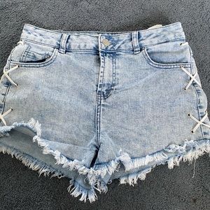 Denim cut off shorts with string detailing